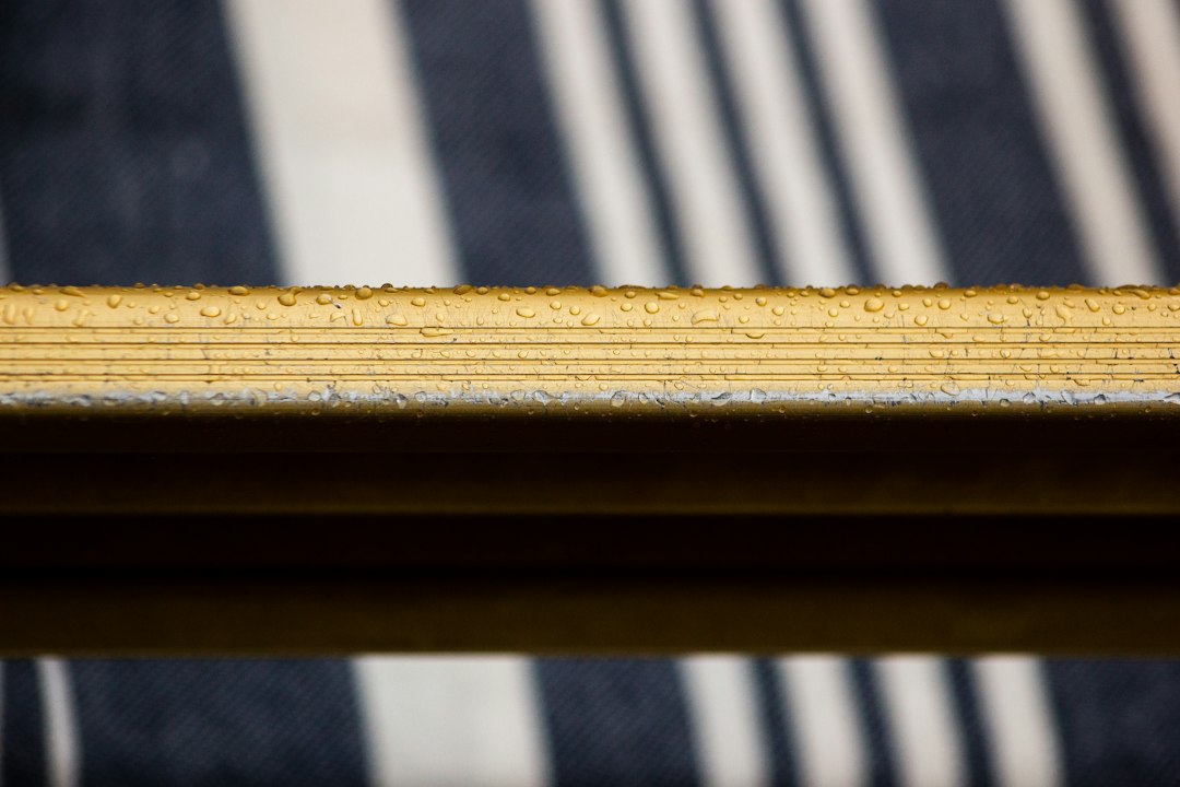 Wooden frame with water drops on its surface